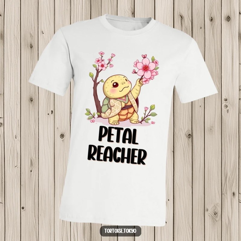 Funny Kawaii Tortoise T-Shirt: Adorable tortoise in patterned kimono, reaching for a cherry blossom, with charming and humorous detail.